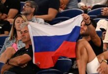 • A supporter holds a flag of Russia during the men’s singles match