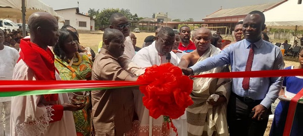 • Inset: Mr Nikoi (second from left) and other dignitaries cutting the tape to inaugurate the school block Photo: Victor A. Buxton