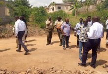 • Management and Governing Council members inspecting a land