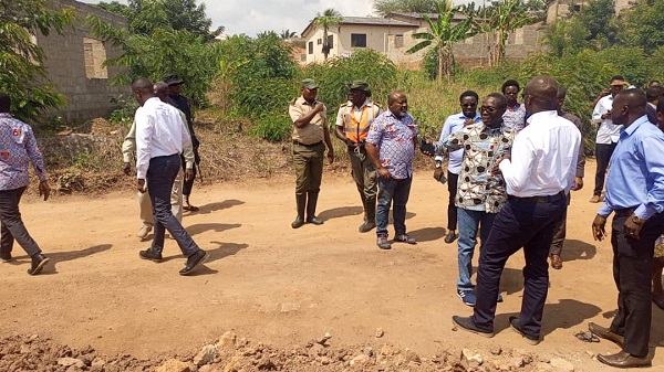 • Management and Governing Council members inspecting a land
