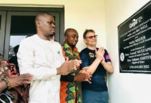 • Mr Mustapha (left), Mr Ashitey and Mr Van Der Weij applauding after a plaque on the facility was unveiled