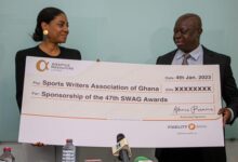 • SWAG President Kwabena Yeboah (right) and Mrs Angela List displaying the dummy cheque at the event