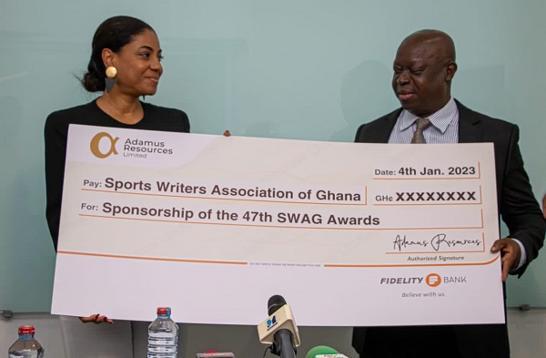 • SWAG President Kwabena Yeboah (right) and Mrs Angela List displaying the dummy cheque at the event
