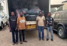 • The suspects in front of the truck loaded with bags of narcotics
