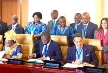 • Mr Mustapha Ussif (seated second right) and the stakeholders (all seated) signing the negotiated agreement for the African Games