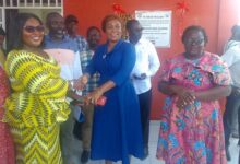 • Mrs Adjabeng (inset) handing the keys to the facility to Dr Opoku