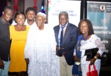 • Alhaji Dodoo Ankrah flanked by family members after receiving his award