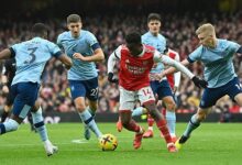 • Arsenal’s Eddie Nketiah (centre) trying to dribble his way through