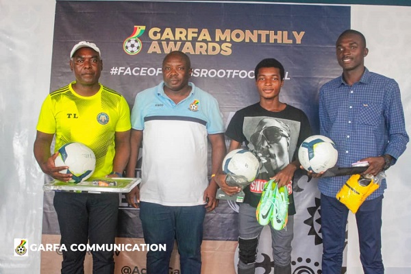 • Lokko (left) with Mr Aboabire (second left) and other winners