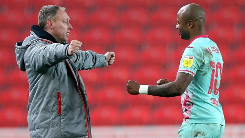 • Ayew (right) reunites with former boss Steve Cooper at the City Ground