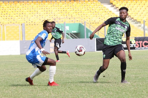 • Who wins the ball? Oly's Emmanuel Antwi (left) in contention for the ball with Collins Boah Photo: Raymond Ackumey