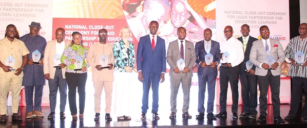 • Dr Yaw Adutwum (middle) with the award winners after the programme. Photo. Ebo Gorman
