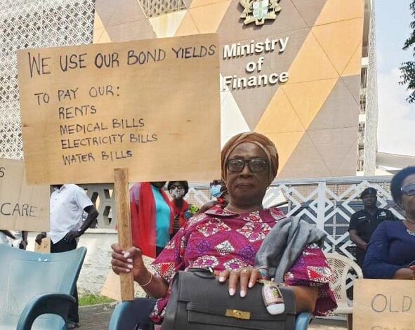 • Former Chief Justice Sophia Akuffo with a placard during the picketing