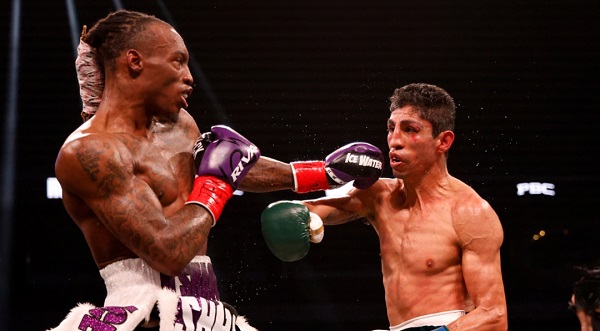 • Foster (left) dishing it out to Rey Vargas