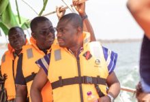 Dr Eric Nkansah (in front) with some dignitaries wearing life jackets during his visit to the Volta Lake