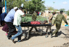 • A man is wheeled on a stretcher after he was injured when their public service vehicle hit an improvised explosive device