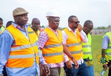 Inset: The Minister (second left), Mr Hadzide (third right) and contractors inspecting the Ho multipurpose youth and sports centre