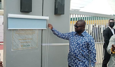 • Boakye unveiling the plaque to inaugurate the building.