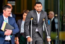 Kyrgios (right) leaves the magistrate’s court in Canberra yesterday