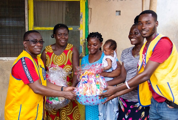 • Mr Appiah (left) presenting a hamper to beneficiaries