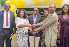 • Dr Charity Sarpong (second from left) handing over the keys of the truck to Mr John Achana