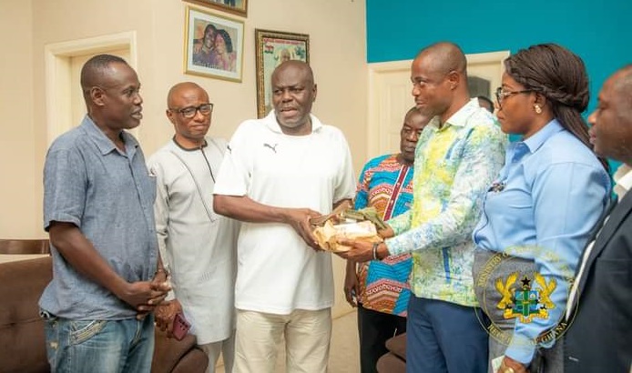 • Mr Sellas Tetteh (third left) receiving the money from the Deputy Sports Minister