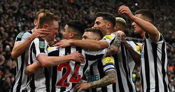 • Newcastle players mob Sean Longstaff to celebrate his brace