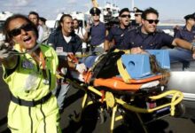 • Italian emergency services helping survivors