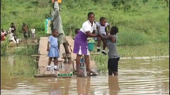 • Some of the children crammed on the canoe going to sch