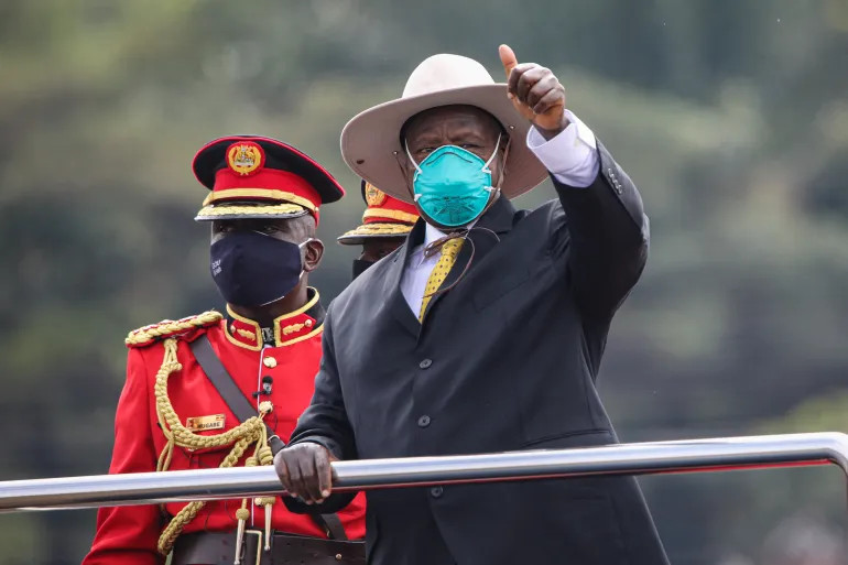 • Ugandan President, Yoweri Museveni, foreground gestures during the inauguration ceremony for his sixth term in Kampala, Uganda, on May 12, 2021