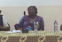 • Prof. Asiedu (in the middle) delivering her remarks at the forum
