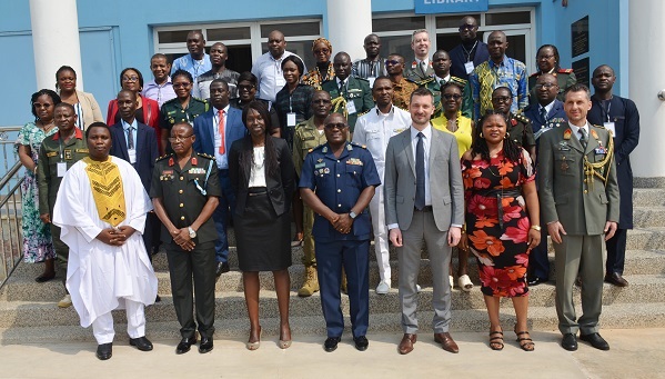 • Air Cdre George Arko-Dadzie (middle), Deputy Commandant, KAIPTC, Mr Moritz Ehrmann (third from right) and Mrs Fatou Ndour (third from left) with other participants
