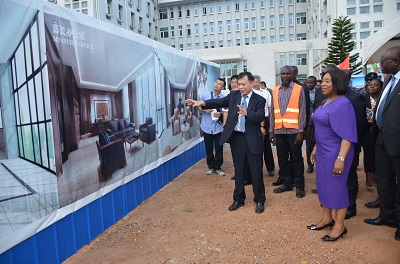 Ambassador Lu Kun(middle) showing Ms Shirley Ayorkor Botchwey and other officials round the drawings of the proposed annex office project. Photo. Vincent Dzatse