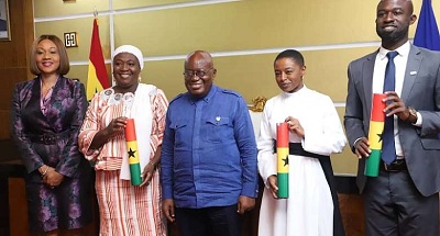 President Akufo-Addo (middle) and Ms Jean Mensah (left) with the three new members to the Board