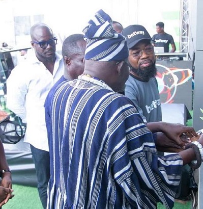 • Appiah (behind) looks on as Asafoatse Nii Madoshwe III (right) supported by Rex Danquah Jnr cut the tape for the opening of the Betway Osu Experience Centre