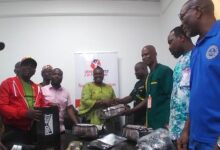 • Mr Quartey (fourth from right) receiving the items from Mrs Acquah-Harisson