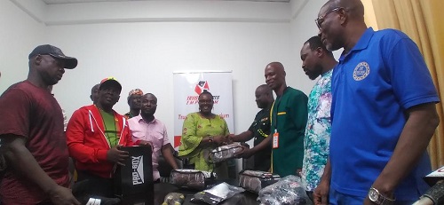• Mr Quartey (fourth from right) receiving the items from Mrs Acquah-Harisson