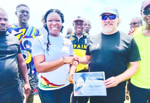 • GFDA Technical team member, Mr Troy Duffield, presenting a certificate to one of the female participants