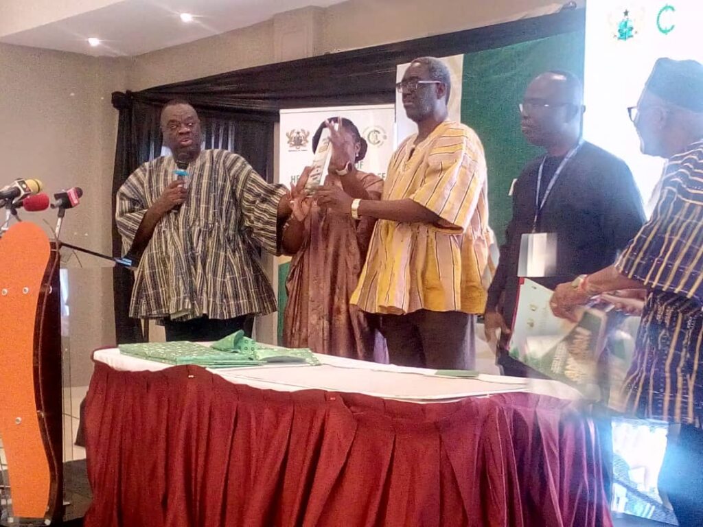 Dr Awal (left), Nana Kwasi Agyekum-Dwamena (third from right) and other dignitaries launching the document