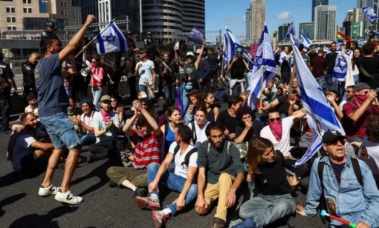 • Tens of thousands of protesters have taken to the streets across Israel