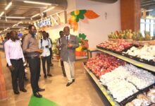 • Mr Godwin Avenorgbo (right) taking the media personnel the new mall Photo: Vincent Dzatse