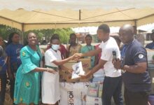 • Mr Tex Kumodji, administrator of HOGF (second right), presenting the items to Lovia Adjei (second from left)