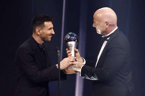• Messi (left) receiving his award from FIFA boss Gianni Infantino