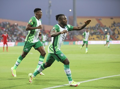 Moses Simon (right) joined by a colleague to celebrate Nigeria's own goal