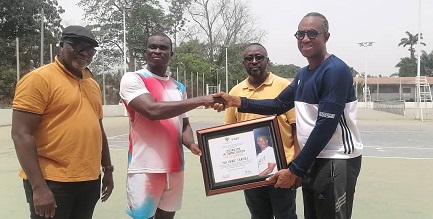• Mr Boni Quarshie (right) presenting a citation to Mr Owusu while other officials look on