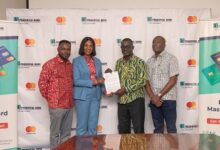 • Mr Gyebi (second from right) exchanging the signed MoU with Mrs Momoh ple