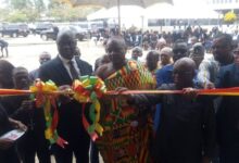 • Inset: Chief Justice Yeboah (left) being assisted by other dignitaries to cut the tape to officially open the court
