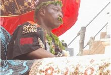 • Nana Dadzie being paraded in a palanquin through the principal streets of Abura Dunkwa