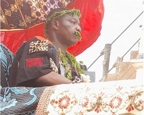 • Nana Dadzie being paraded in a palanquin through the principal streets of Abura Dunkwa