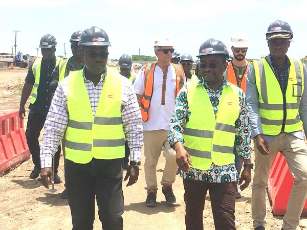 • Inset: Some members of the committee inspecting the works at the site